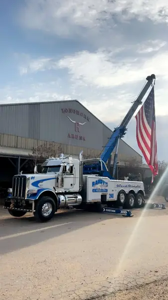 Randy's Towing wrecker flying American flag